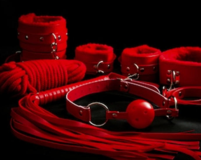 A Fem Dom BDSM material is displayed, and it is a sexy product.