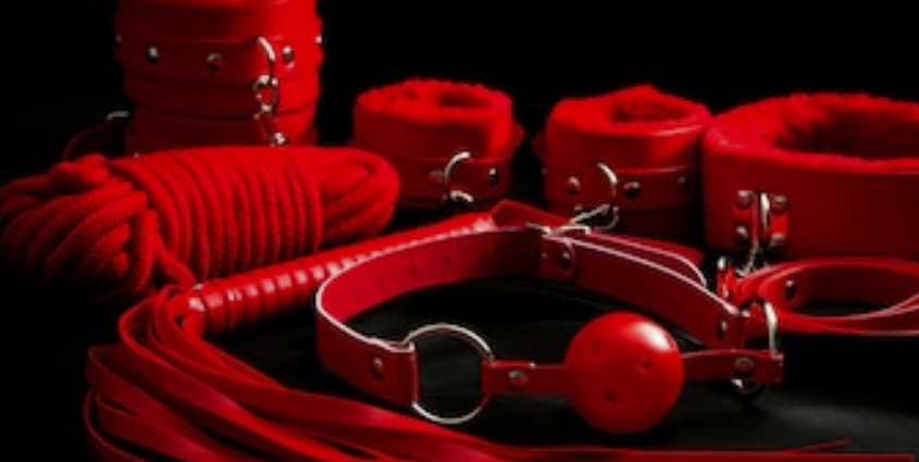 A Fem Dom BDSM material is displayed, and it is a sexy product.