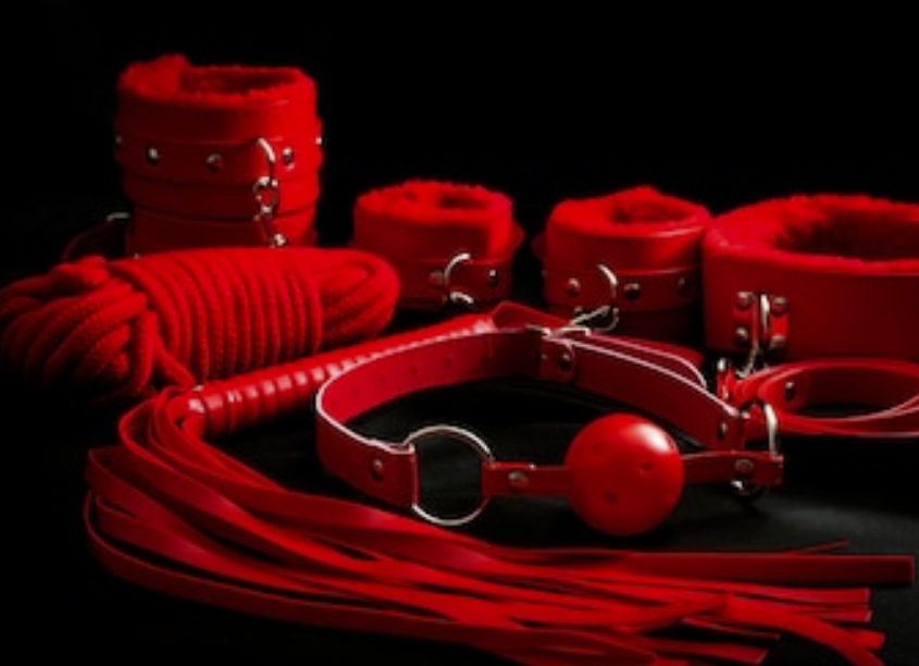 A Fem Dom BDSM material is displayed, and it is a sexy product.